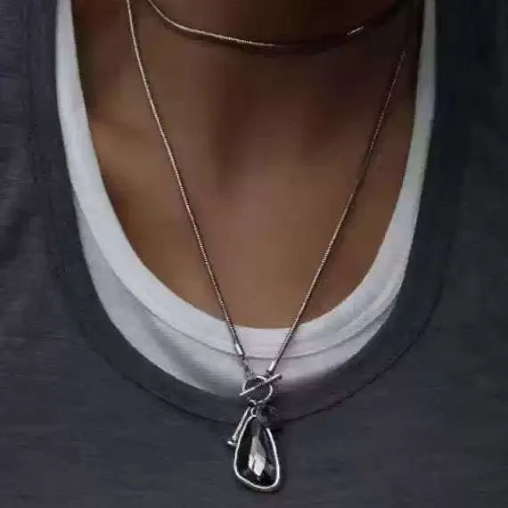 Geometric plaid pendant on snake bone chain necklace measuring 50 cm length