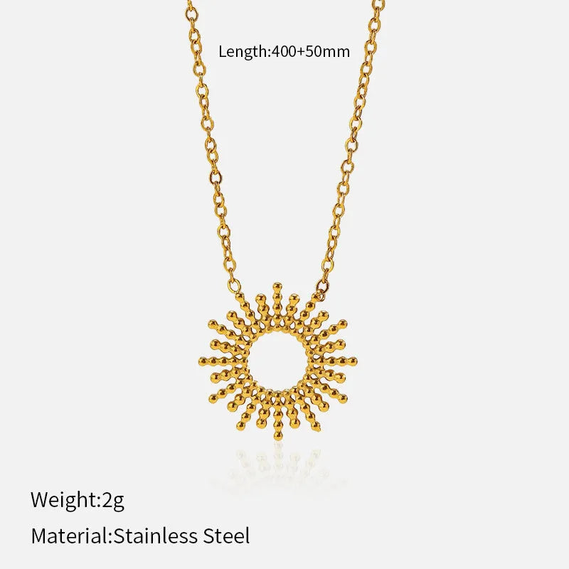 Gold tone geometric jewellery set with sun motif including necklace and bracelet for women