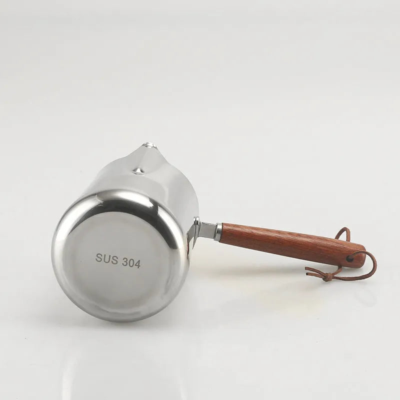 Stainless steel coffee cup with measurement scale and wooden handle in simple design