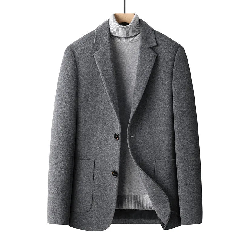 A man wearing a slim-fit grey wool blend suit jacket for autumn and winter leisure wear.