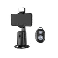 Black intelligent face tracking mobile phone holder with rotating camera head and ribbon lighting on desktop