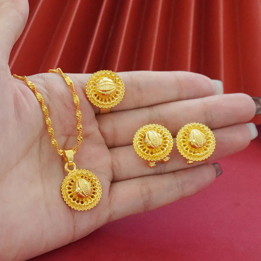 Gold-plated three-piece jewellery set with floral pendant necklace, matching ring and earrings