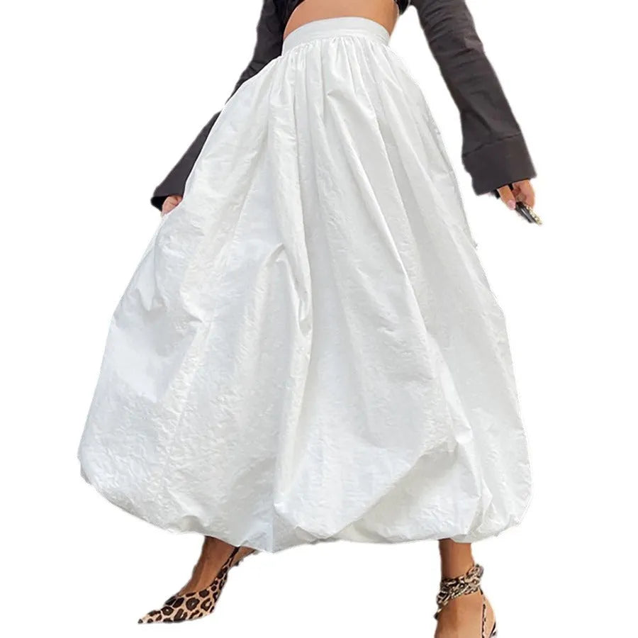 Women's solid colour cotton long skirt in black on a hanger.
