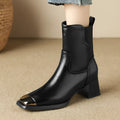Brown cowhide leather women's Martin boots with side zipper and high heel on a white background.