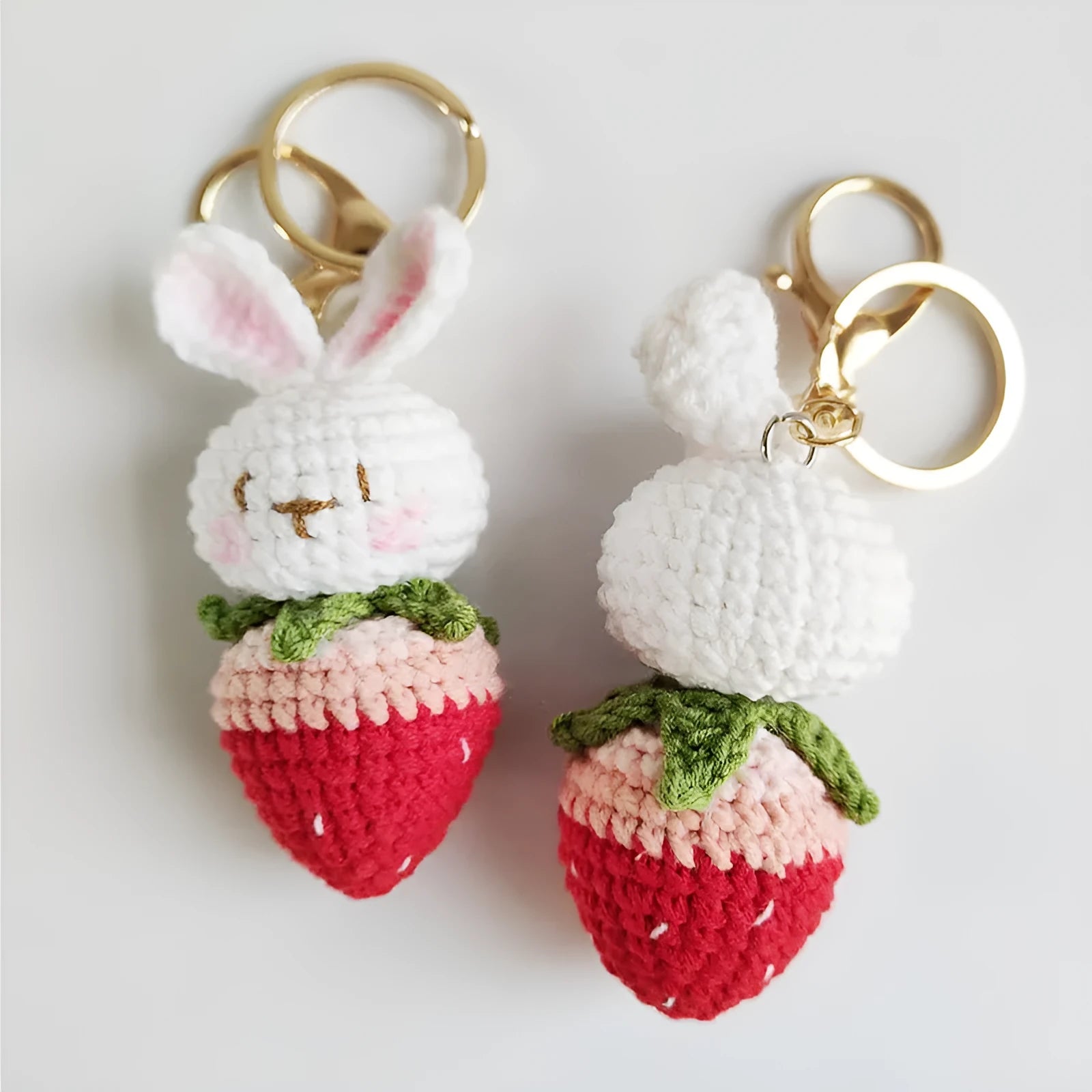 White hand-woven wire rabbit pendant with strawberry pattern and key