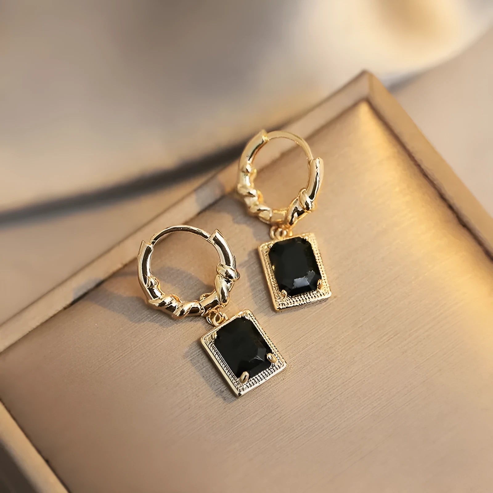 Pair of black zircon and copper geometric quadrilateral earrings in retro French Court style.