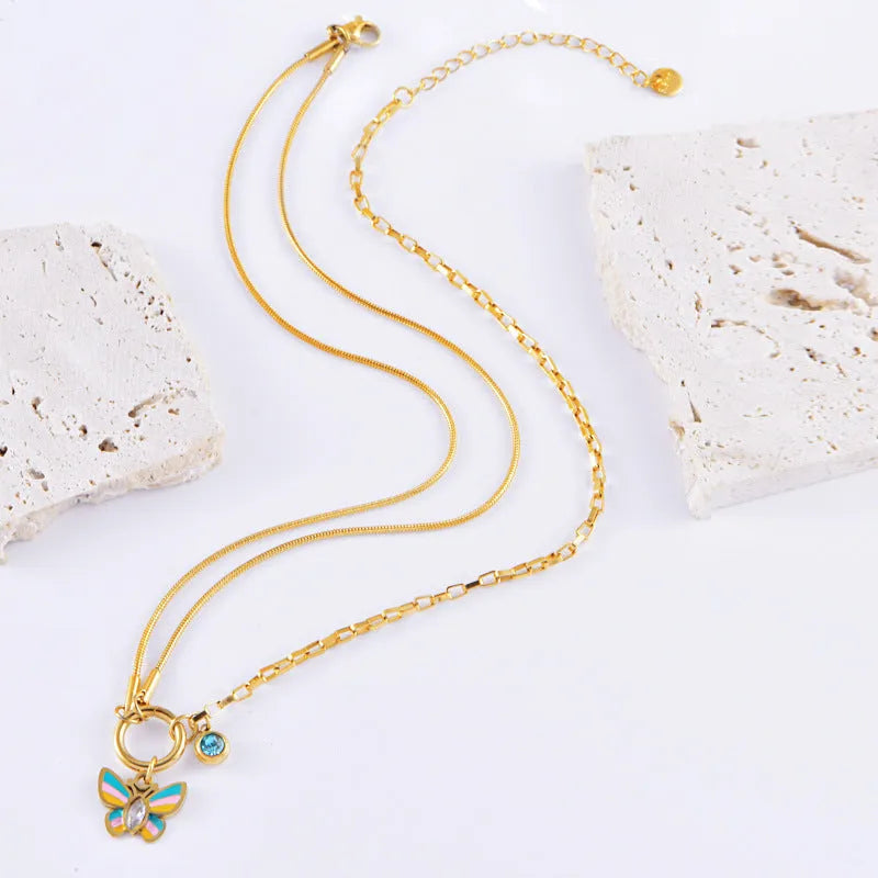 Gold titanium steel epoxy butterfly necklace and bracelet set with snake bones chain.