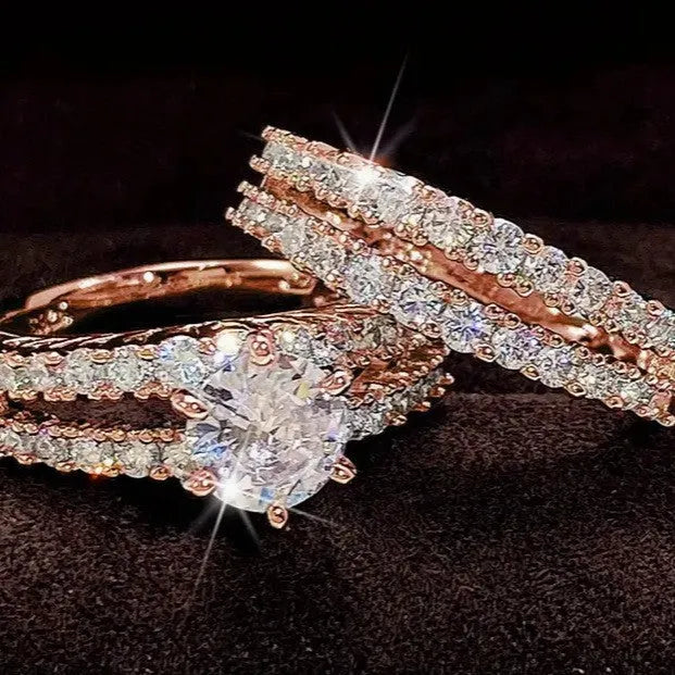 Two fully jewelled geometric round female rings in silver colour with diamond treatment surfaces