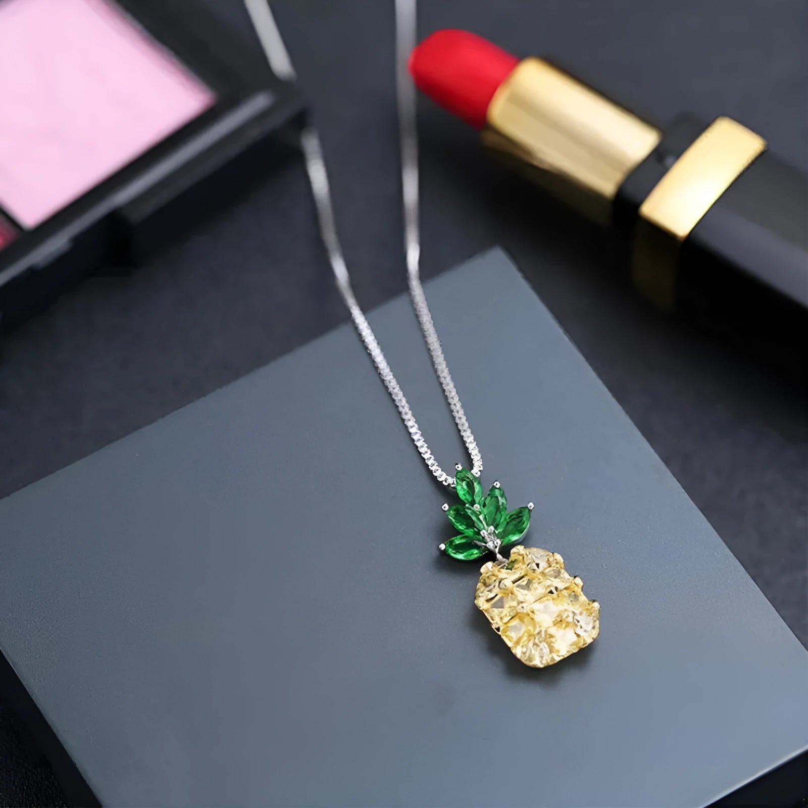 Silver plated women's necklace with a geometric pineapple diamond pendant charm.