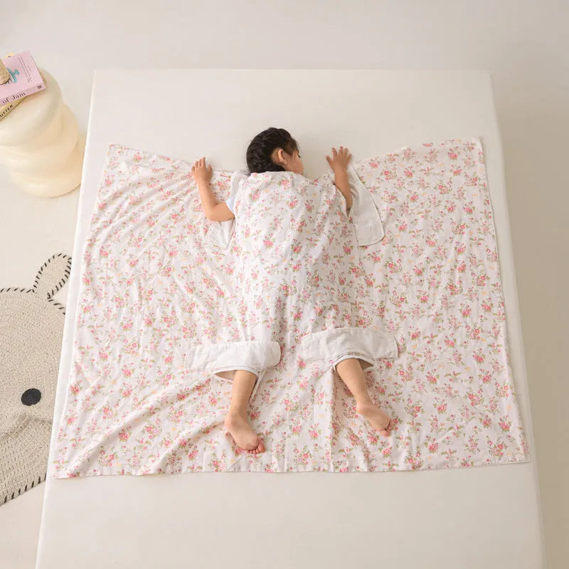 Colourful patterned anti-kick sleeping bag blanket folded to show size and design.
