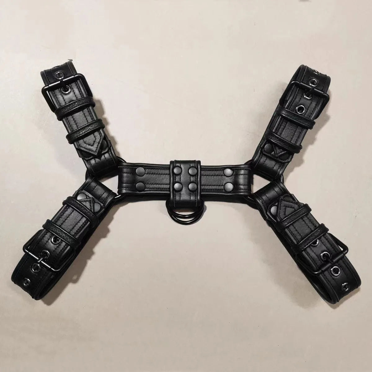 Black leather chest bondage strap with metal buckle adjustment for adult muscle harness