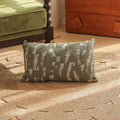 Square pillow cover with woven plant pattern in Nordic style, shown on a sofa as a waist pillow.