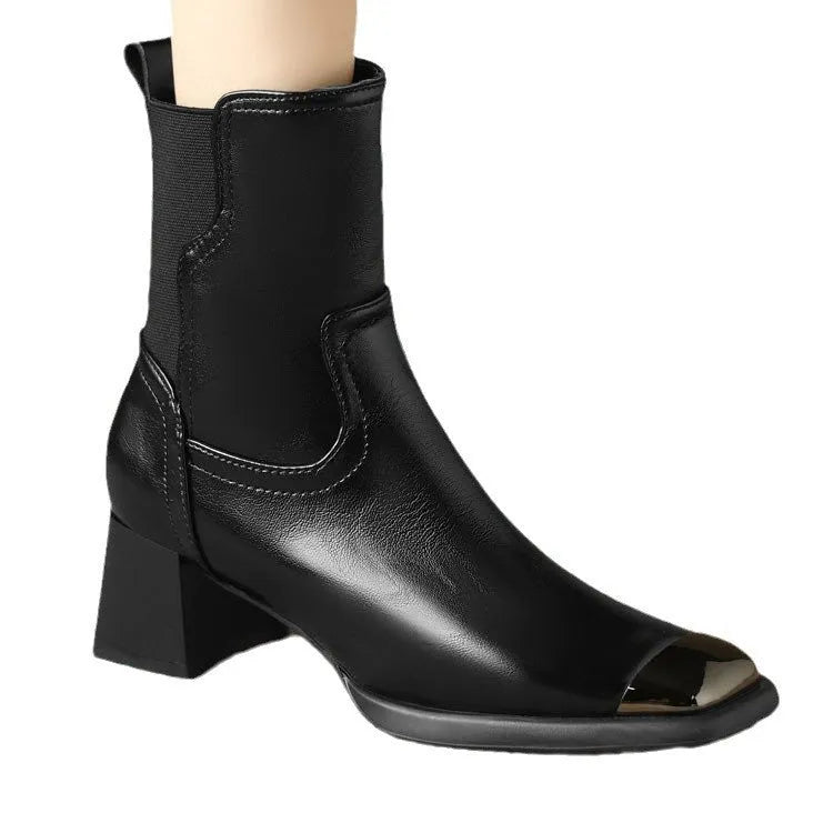 Brown cowhide leather women's Martin boots with side zipper and high heel on a white background.