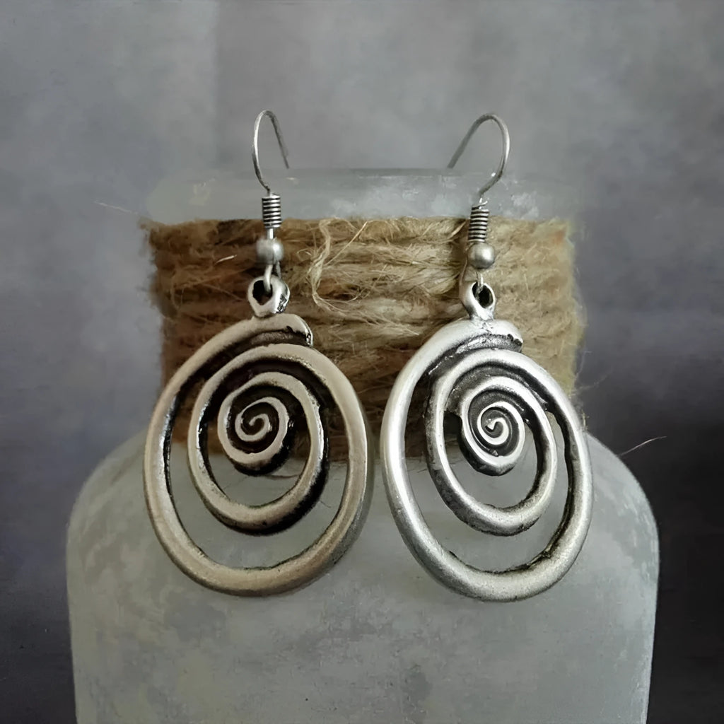 Silver alloy geometric spiral earrings with distressed finish measuring 2.6cm wide by 5cm long