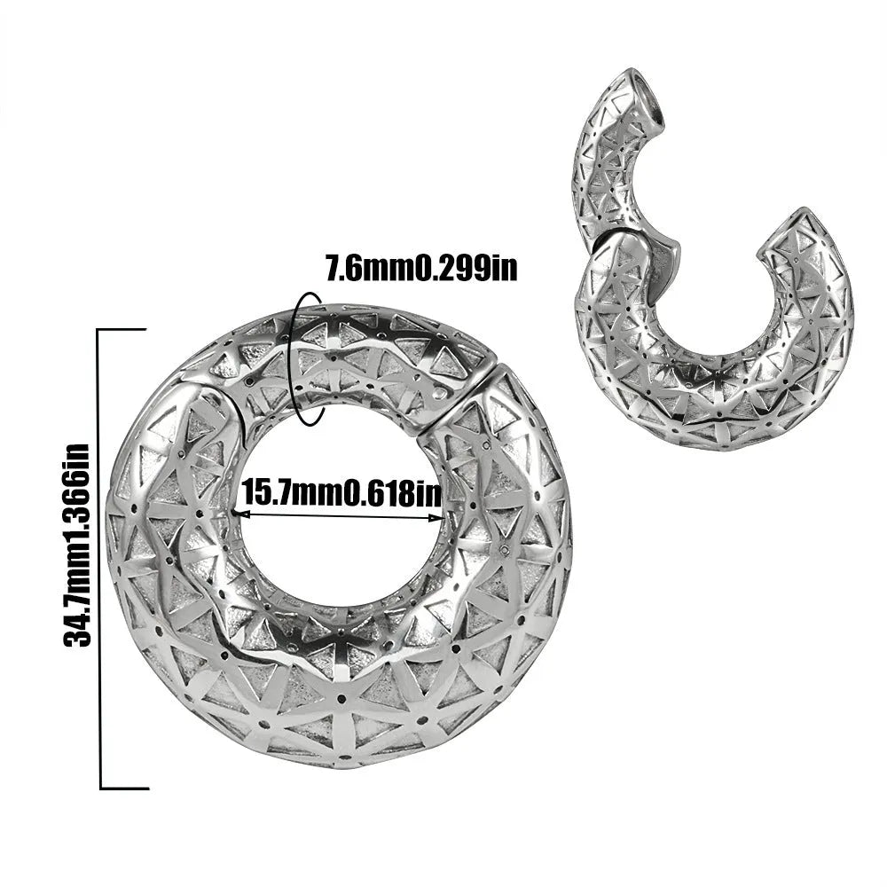 A pair of stainless steel fashion earrings with an intricate totem pattern design in a silver-toned finish.