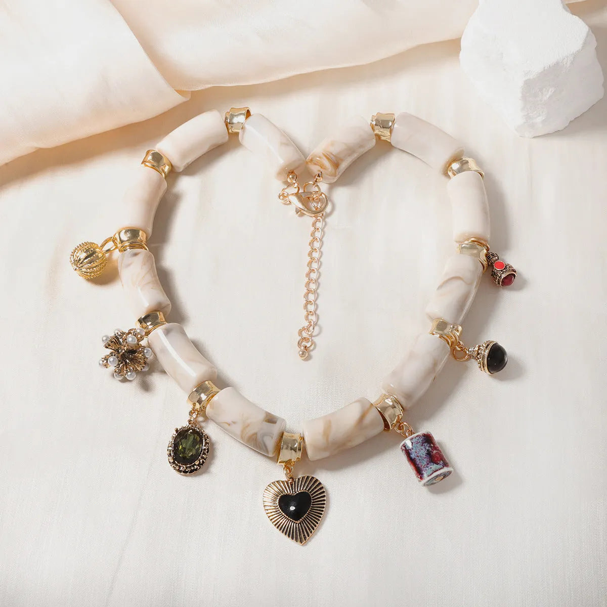 Women's heart-shaped bamboo resin pendant necklace with electroplating finish