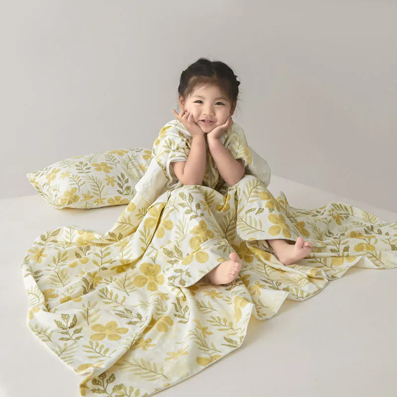Colourful patterned anti-kick sleeping bag blanket folded to show size and design.