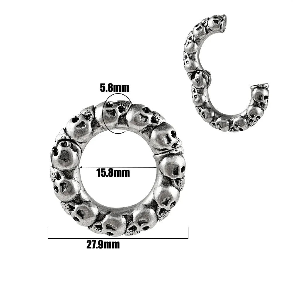 A pair of stainless steel fashion earrings with an intricate totem pattern design in a silver-toned finish.