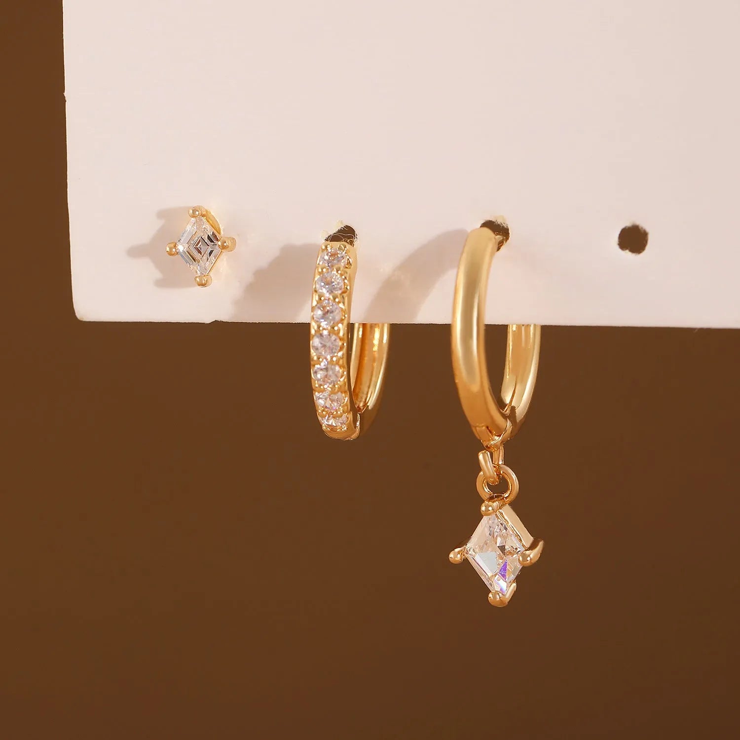 Ladies three-piece geometric earring set with inlaid zircon in gold or white finish
