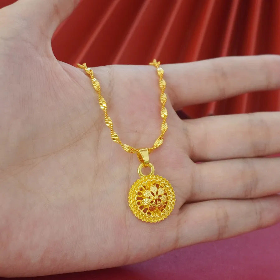 Gold-plated three-piece jewellery set with floral pendant necklace, matching ring and earrings