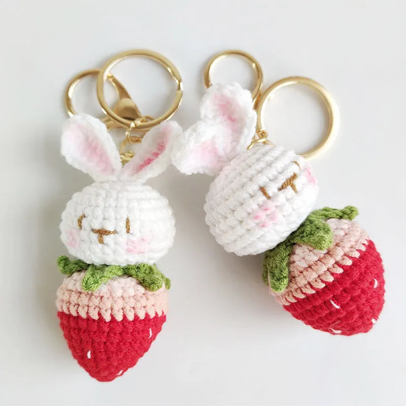 White hand-woven wire rabbit pendant with strawberry pattern and key