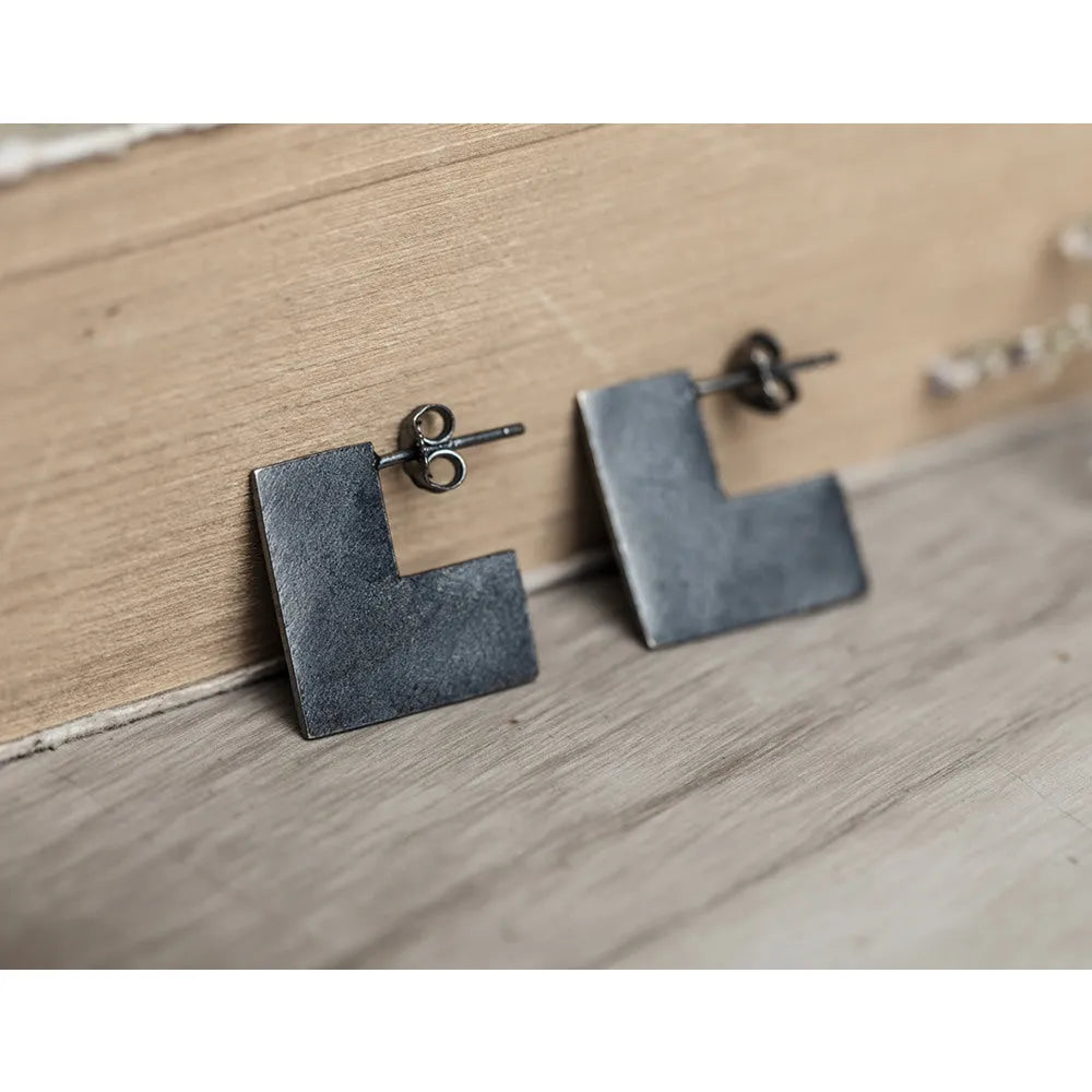 Oxidation black geometric square sterling silver earring ring on a 16mm scale.