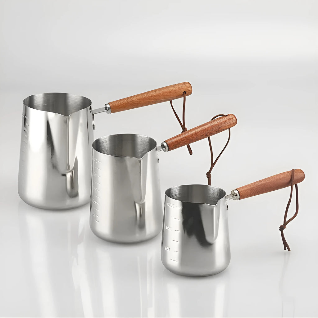 Stainless steel coffee cup with measurement scale and wooden handle in simple design