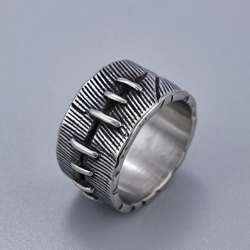 Titanium steel geometric U-shaped double ring in retro black colour, showing stitched design detail.