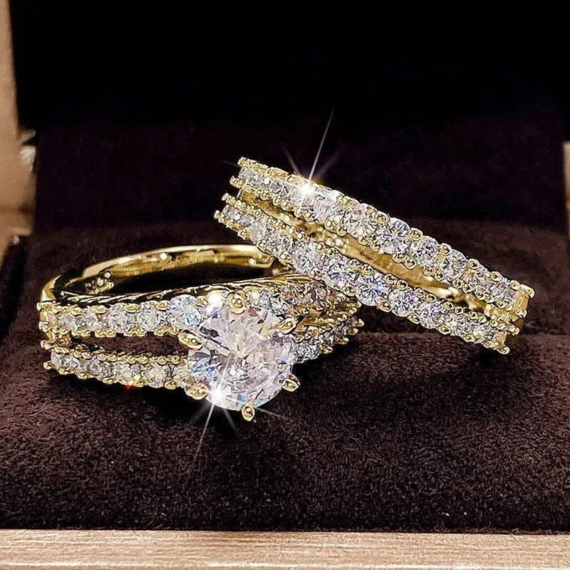 Two fully jewelled geometric round female rings in silver colour with diamond treatment surfaces