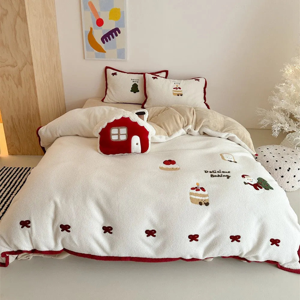 Winter Christmas cartoon snowman print bedding four-piece set on a single bed, showing duvet cover, pillowcases, and sheet.