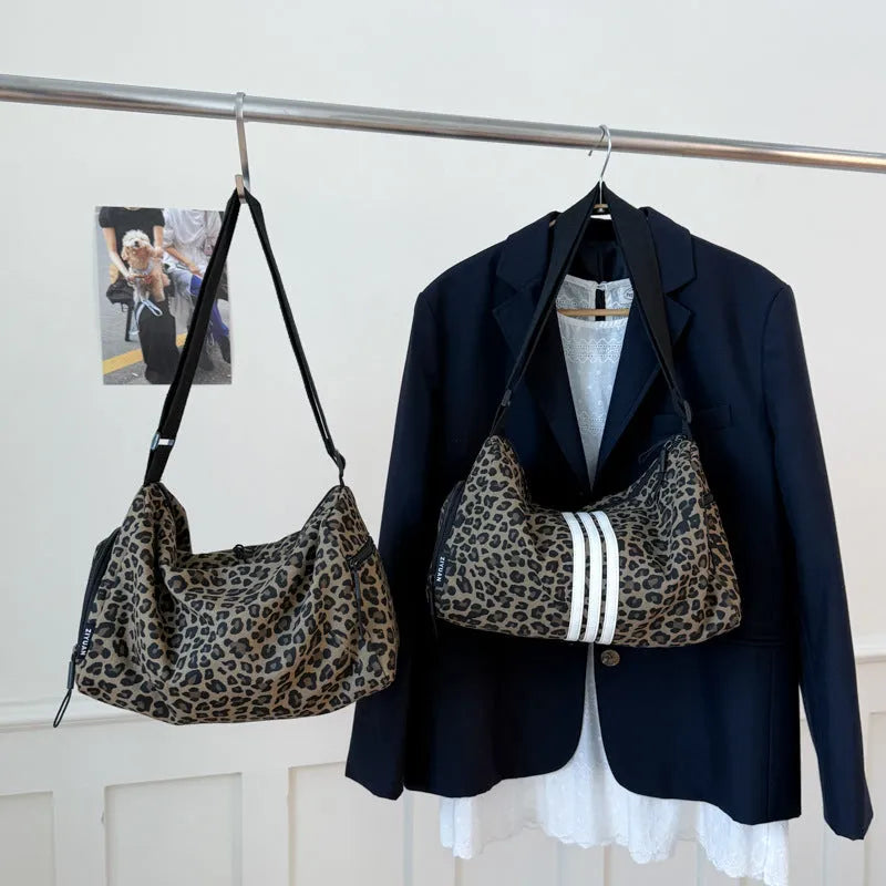 Leopard print sports style shoulder messenger bag with cross-body strap and large main compartment