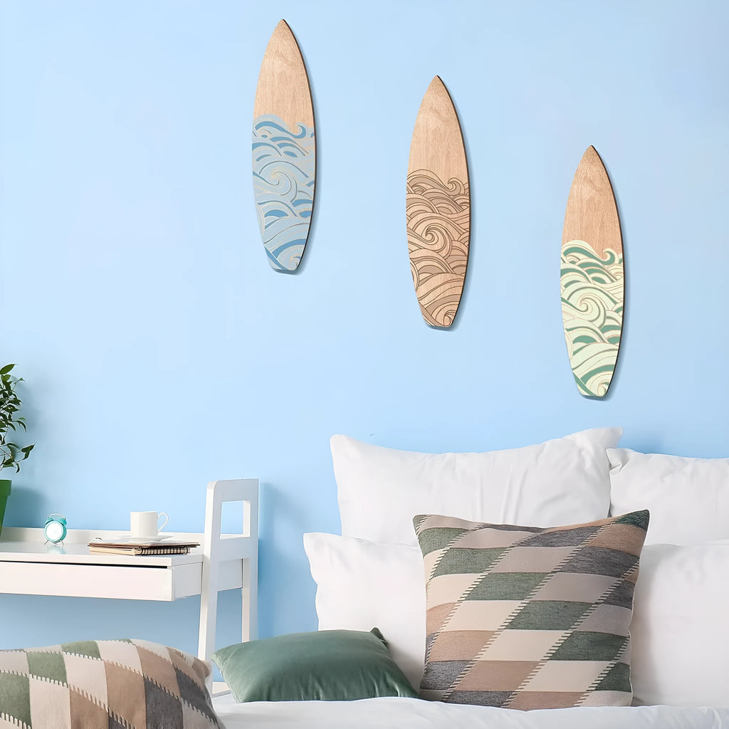 Three identical wooden surfboard shaped wall decorations on a white background.