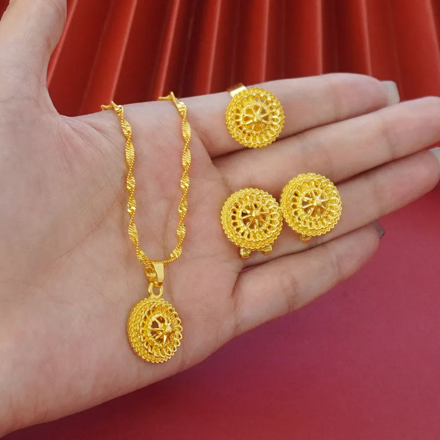 Gold-plated three-piece jewellery set with floral pendant necklace, matching ring and earrings