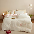 Winter milk fibre four-piece bed set with reactive printed green Christmas tree pattern on quilt cover and pillowcases