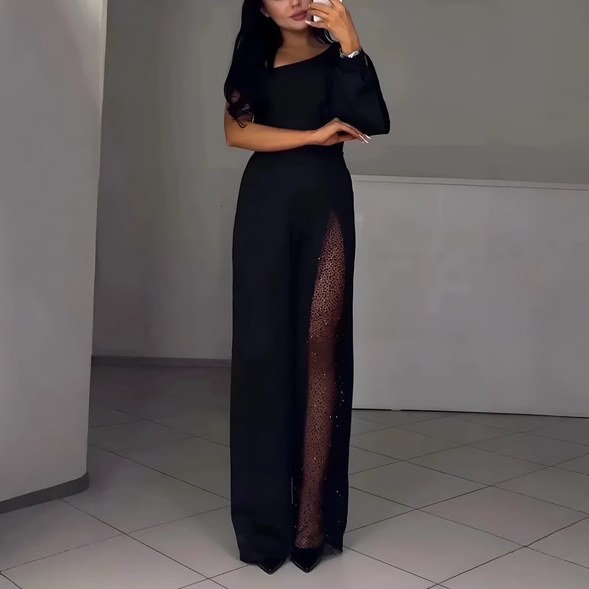 Women's black polyester jumpsuit with oblique shoulder design and high side slit