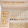 108 gold and yellow geometric alloy earrings with round pearl elements