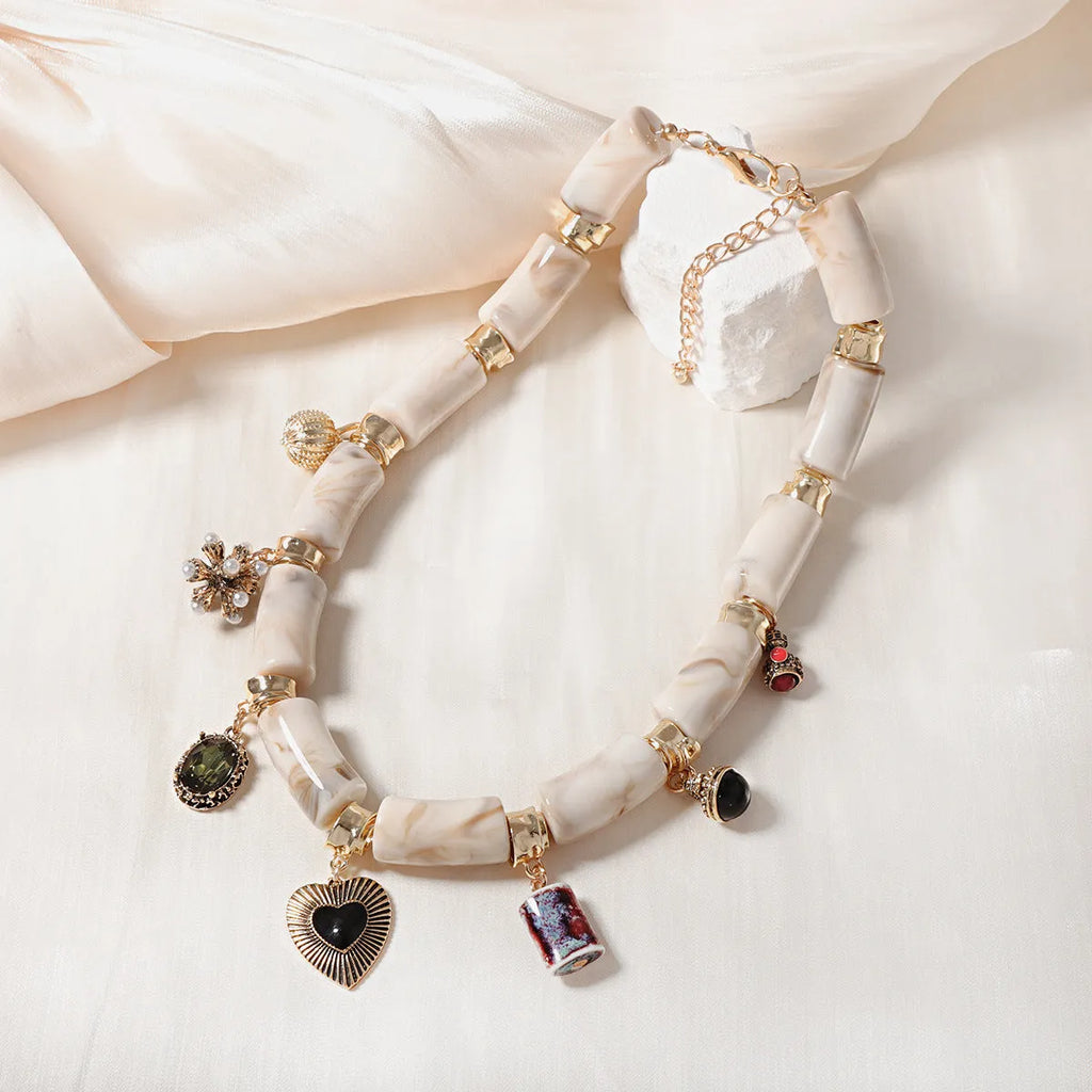 Women's heart-shaped bamboo resin pendant necklace with electroplating finish