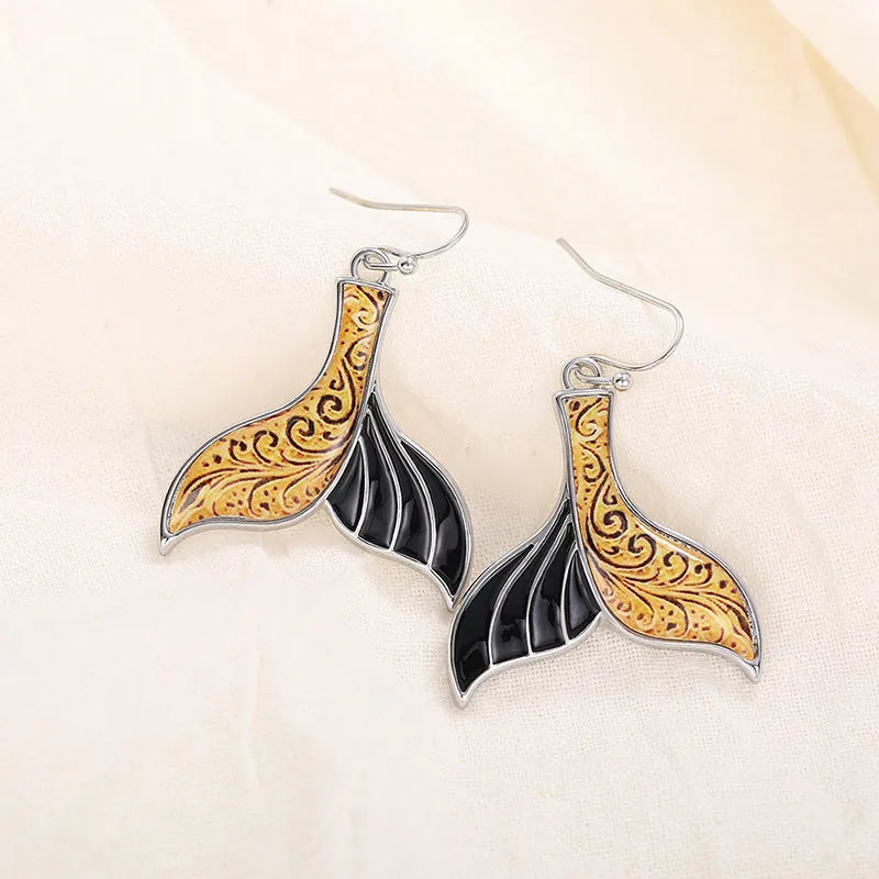 Women's white gold colour fishtail earrings with retro whale design elements