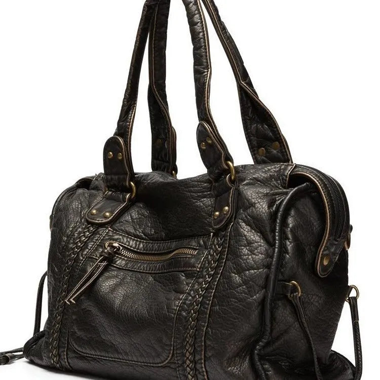Women's brown retro motorcycle style messenger bag with woven texture and single shoulder strap