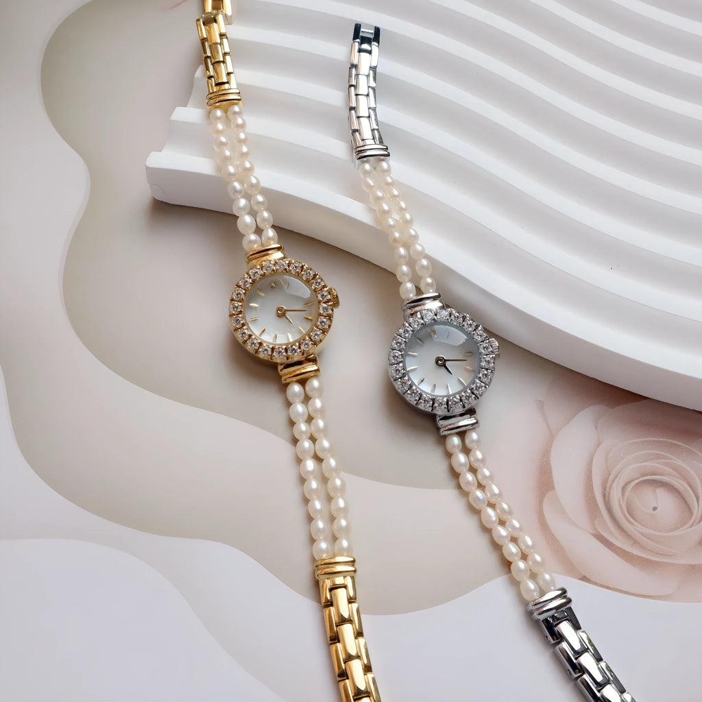 Women's light gold freshwater pearl bracelet watch with round dial on wrist