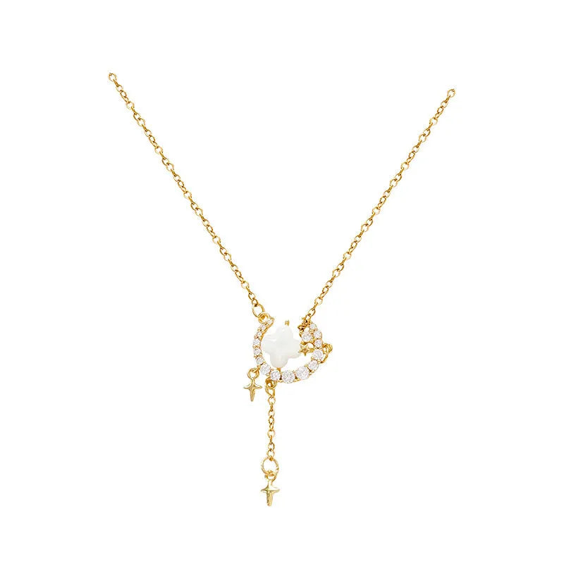 Women's gold necklace with star and moon pendant featuring zirconium crystal treatment