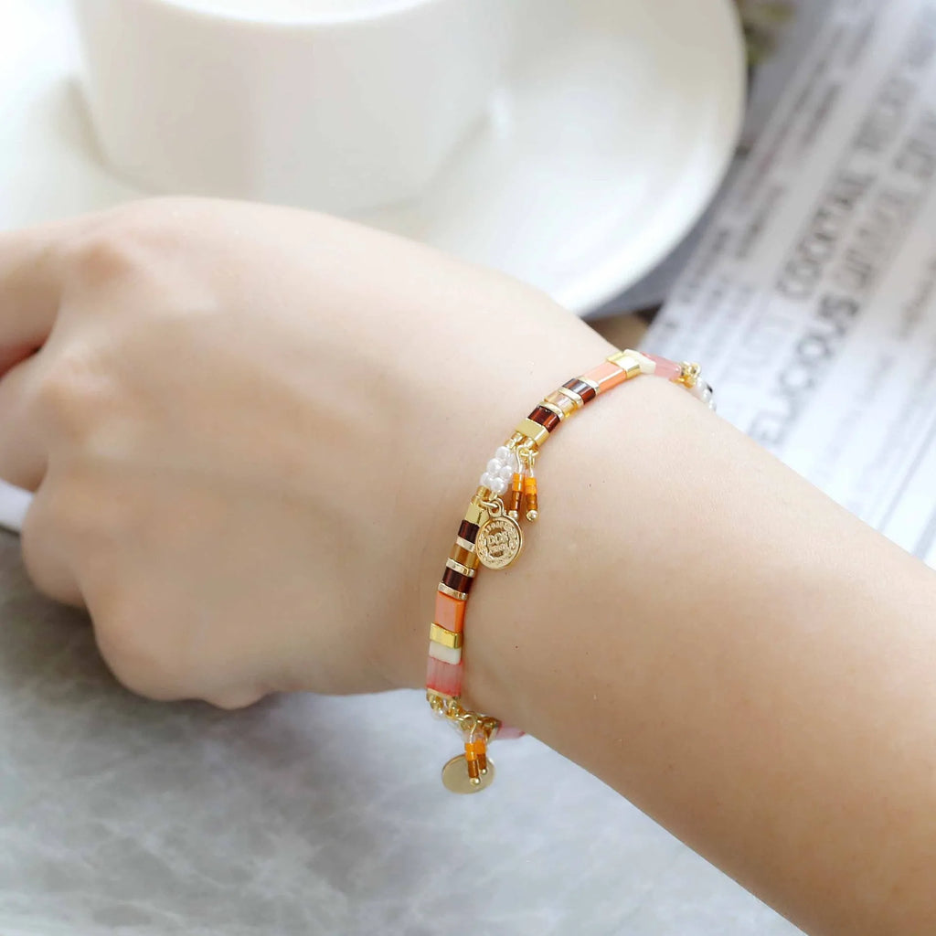 Handmade women's glass coloured beaded bracelet with imitation pearls in a European and American design style.