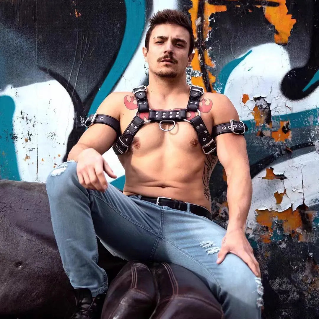 Black leather chest bondage strap with metal buckle adjustment for adult muscle harness
