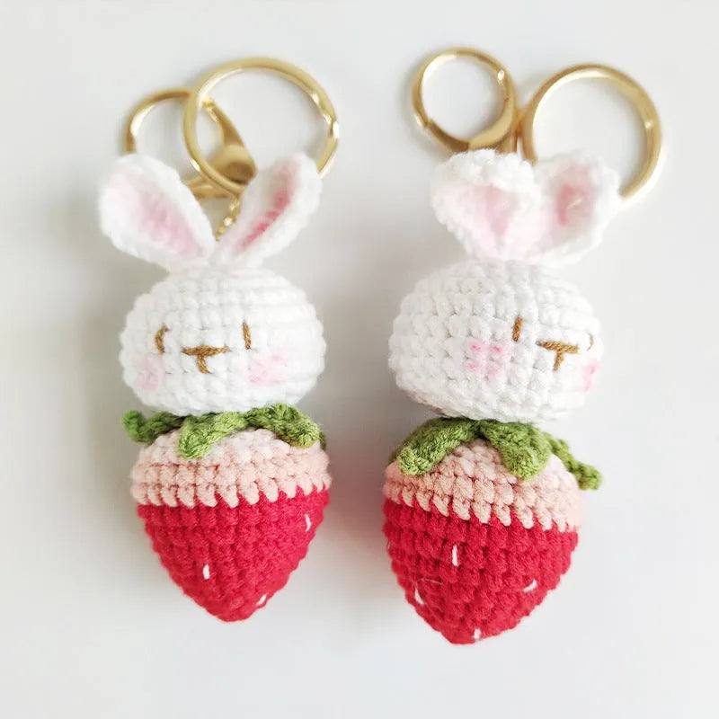 White hand-woven wire rabbit pendant with strawberry pattern and key