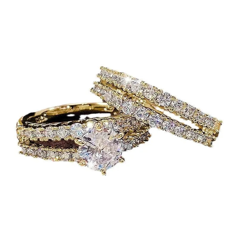 Two fully jewelled geometric round female rings in silver colour with diamond treatment surfaces
