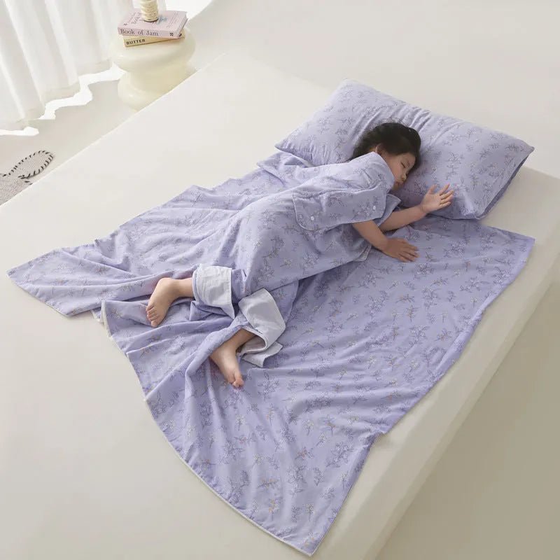 Colourful patterned anti-kick sleeping bag blanket folded to show size and design.
