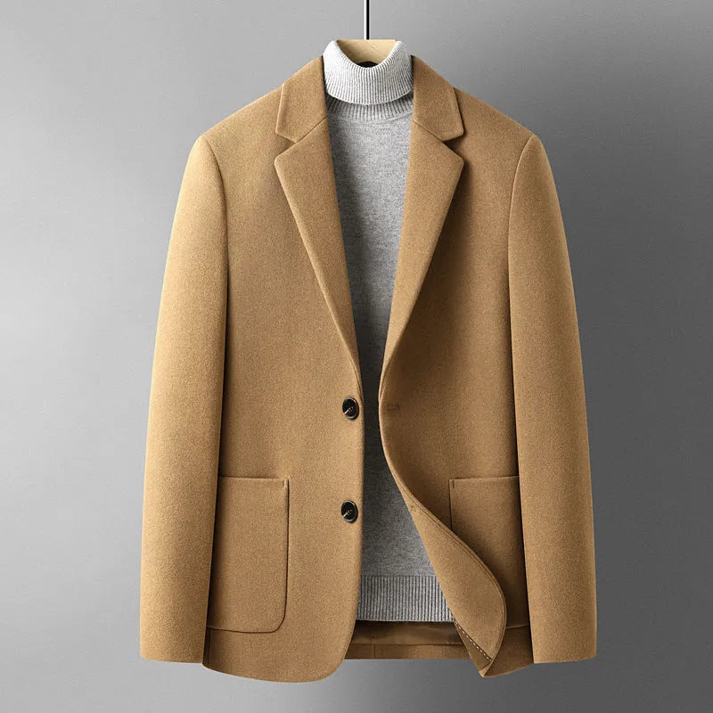 A man wearing a slim-fit grey wool blend suit jacket for autumn and winter leisure wear.