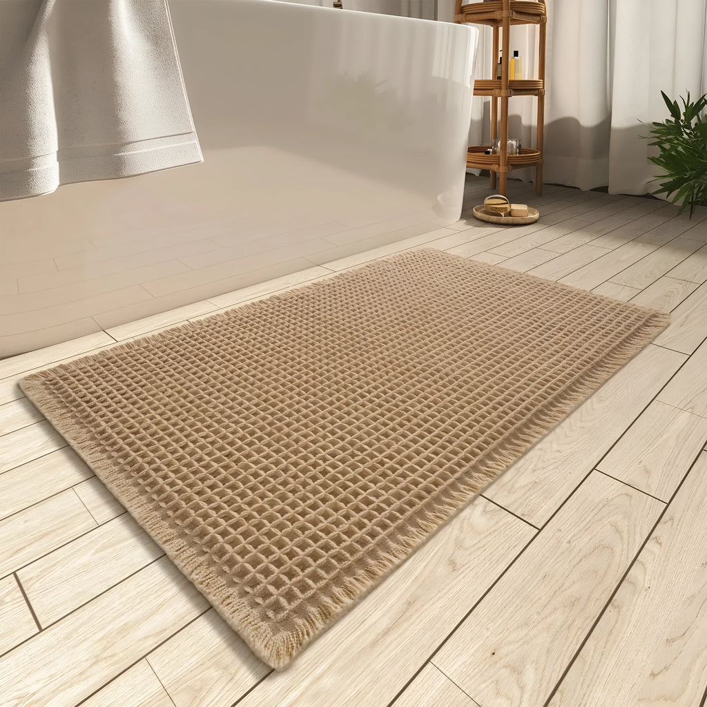A checkered pattern non-slip polyester bathroom floor carpet shown in a beige colour.