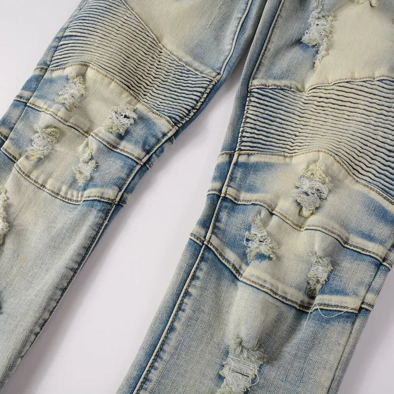Light blue men's slim-fit distressed jeans with hand-frayed details on a mid waist and straight leg.