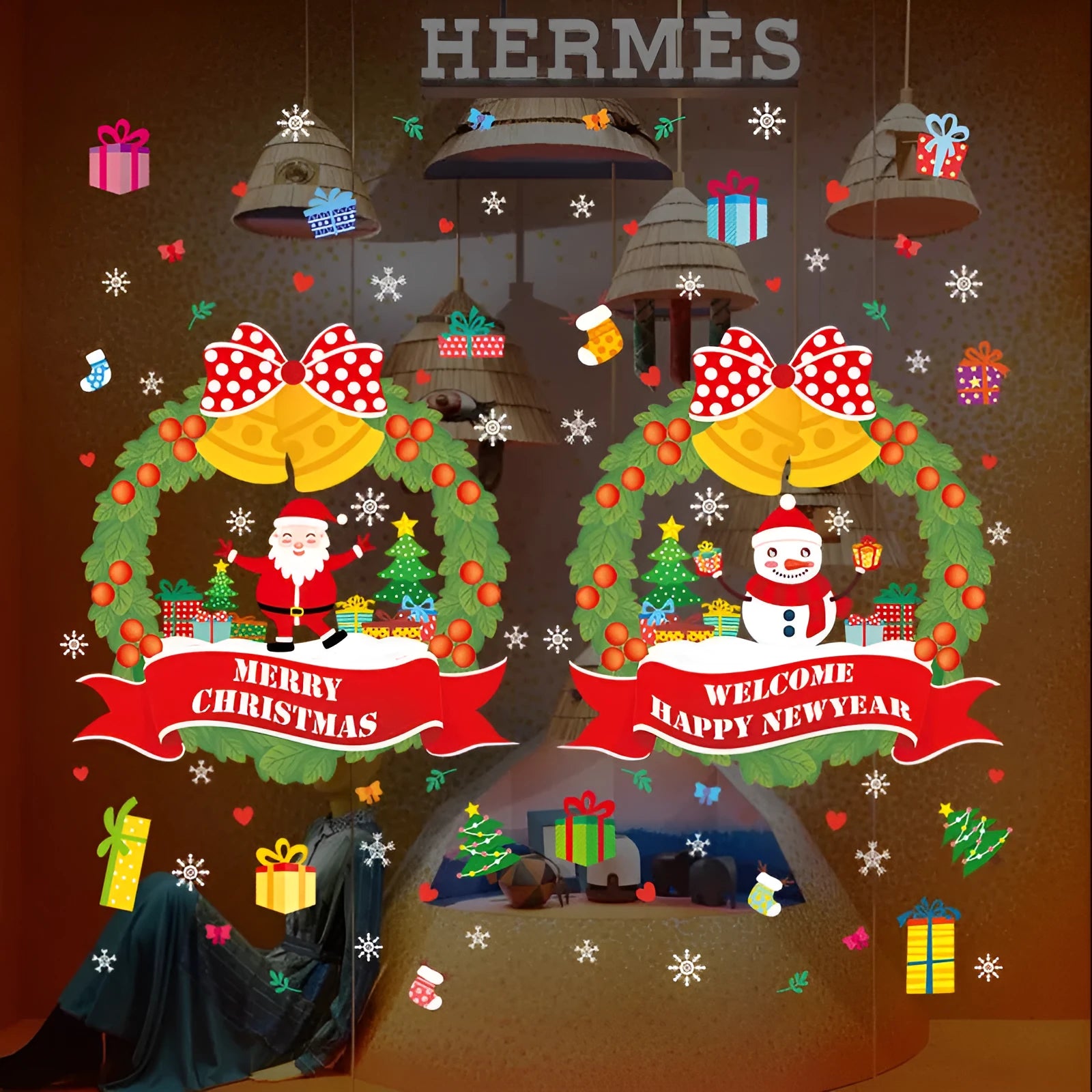 Two large colourful cartoon Christmas static cling wall stickers on a glass window